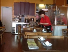 Staff Member Working in Dining Room